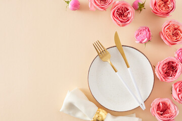 Festive setting concept for Mother's Day. Top view photo of circle plate cutlery knife fork fabric...