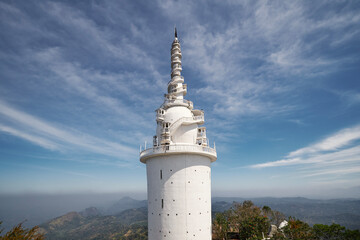 Ambuluwawa tower in central highlands in Sri Lanka. Architecture of tower combines influences of...