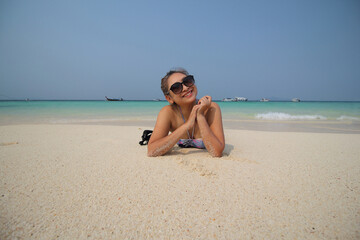 Happy traveler woman enjoys her tropical beach vacation , summer of vacation