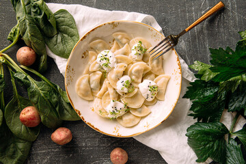 Portion of russian dumplings vareniki with potato filling