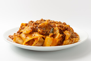 Fried noodles with mala sauce on white background
