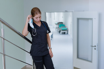 The doctor went out into the corridor to rest during the break. Difficult work shift during a pandemic.