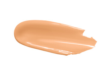 Smear of facial foundation is light beige in color. Isolated on a white background.