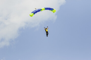 skydiver in the sky with a wing-type parachute