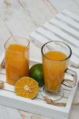 Orange juice. made from fresh squeezed oranges. tangerine. fresh fruit drink without preservatives, a source of natural vitamin C and antioxidants. served in clear glass. citrus nobilis. 