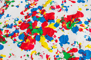 gouache paint stains in yellow red green colors, abstract background