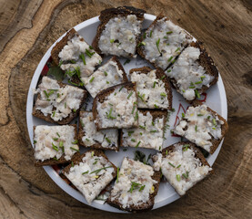 grated lard with garlic on black rye bread with finely chopped dill.