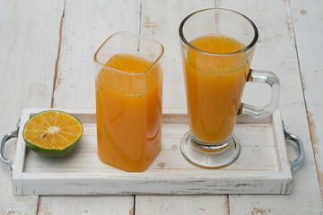 Orange juice. made from fresh squeezed oranges. tangerine. fresh fruit drink without preservatives, a source of natural vitamin C and antioxidants. served in clear glass. citrus nobilis. 