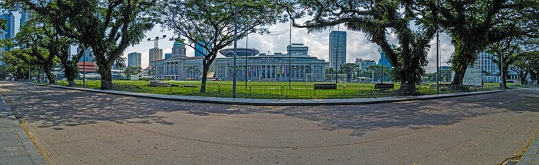 Fototapeta na wymiar Panoramic image along deserted avenue in Singapore