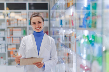 Portrait of young pharmacist in a pharmacy store.