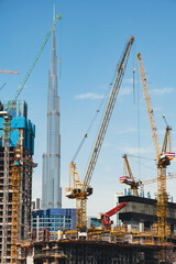 Futuristic and modern commercial and residential highrise tower skyscraper architecture with glass facades and clean lines in downtown Dubai, United Arab Emirates for millionaires and high society	