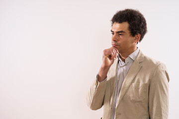 Image of pensive businessman thinking.	