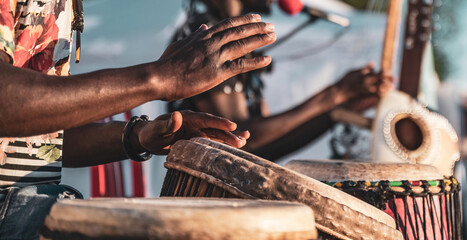 Dynamic performance of Djembe drumming during a live concert - obrazy, fototapety, plakaty