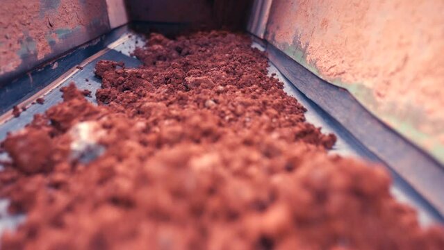 Rocks on belt moving towards camera. Very close. Slow motion 50perc. 4k.