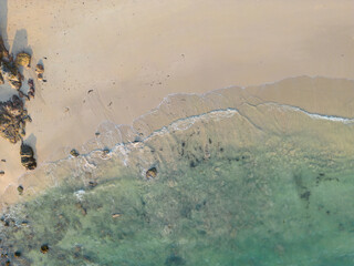 Aerial sea beach wave turquoise water with coconut sunset light