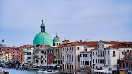 Fototapeta premium Narrow canal with bridge in Venice, Italy. Architecture and landmark of Venice. Cozy cityscape of Venice.