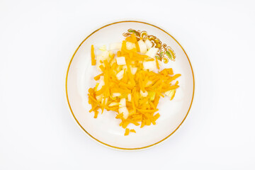 Cutting carrots and onions in isolation on a white background.
