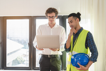 architect explaining client demand plan of construction on the table to contractor.