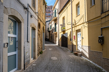 Narrow and cobblestone alley in the town of Enna, Sicily, Italy