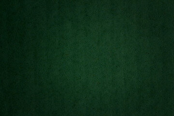 Green paper texture background. Abstract dark green surface for designs.