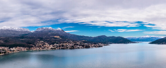 Seascape mediterraneum town in Kotor harbor with mountains and houses under clouds panorama view