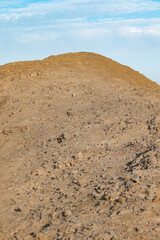 sunrise in the desert with clouds and sand