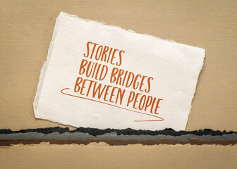 stories build bridges between people, inspirational message on an art paper, communication concept