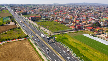 Aerial view of a section of the Italian motorway. On the right the town of Afragola, near Naples and Caserta, Italy.