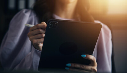 Financial analysts analyze business financial reports on a digital tablet planning investment project during a discussion at a meeting of corporate showing the results of their successful teamwork.