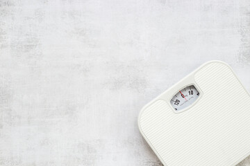 Check your body shape with white weight scales, top view