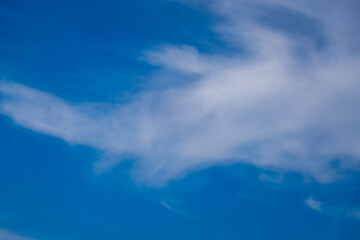 Naklejka na ściany i meble Blue sky with blurred clouds, abstract natural background