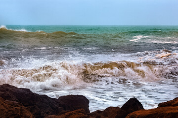 View of the volcanic shore of the Atlantic Ocean in the area of Essaouira in Morocco.