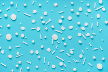 flat lay of white sprinkles over blue background, decoration for banner, poster, flyer, card, postcard, cover, brochure, designers