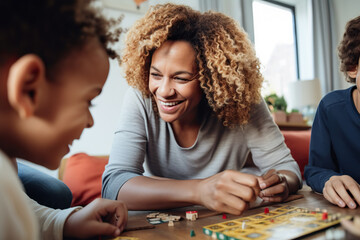 Generative AI illustration of cheerful African American mother with Afro hairstyle smiling and playing table game together with crop children during weekend at home