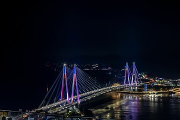 Fototapeta na wymiar Aerial view of the illuminated Jindo Bridge at night in South Korea