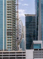 Detail of the facades of apartment blocks and towers in the Business Bay area of Dubai in UAE