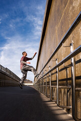 Fototapeta premium Man doing parkour. Free runner