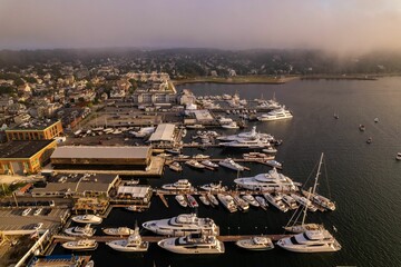 Drone view of Newport Harbor in Rhode Island with gray stormy sky in background