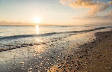 Sunset on the beach with clouds