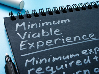 Page of notepad with sign Minimum Viable Experience MVE.