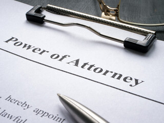 Clipboard with Power of attorney and pen for signing.
