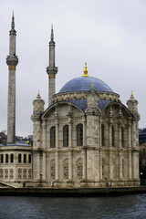 Fototapeta na wymiar River view of the Ortakoy Mosque by the Bosphorus bridge, in Istanbul. (Upright)