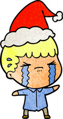 textured cartoon of a man crying wearing santa hat