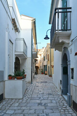 Fototapeta na wymiar A narrow street in Termoli, a seaside town in the province of Campobasso in Italy.