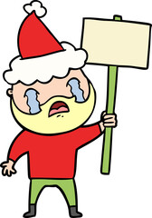 line drawing of a bearded protester crying wearing santa hat