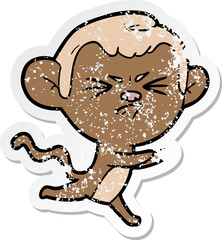 distressed sticker of a cartoon annoyed monkey