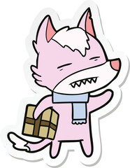 sticker of a cartoon wolf with a gift