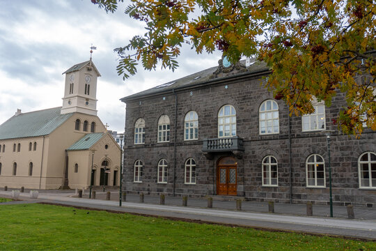 Reykjavik, Iceland: Al&thorn;ingish&uacute;si&eth; (Parliament House) by Austurv&ouml;llur. Home of Al&thorn;ingi, the Icelandic parliament. Reykjav&iacute;k Cathedral (D&oacute;mkirkjan &iacute; Reykjav&iacute;k) Evangelical Lutheran Church.
