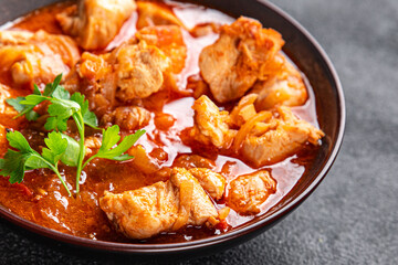 chicken meat tomato sauce, vegetable meal food snack on the table copy space food background rustic top view