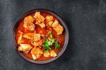 chicken meat tomato sauce, vegetable meal food snack on the table copy space food background rustic top view